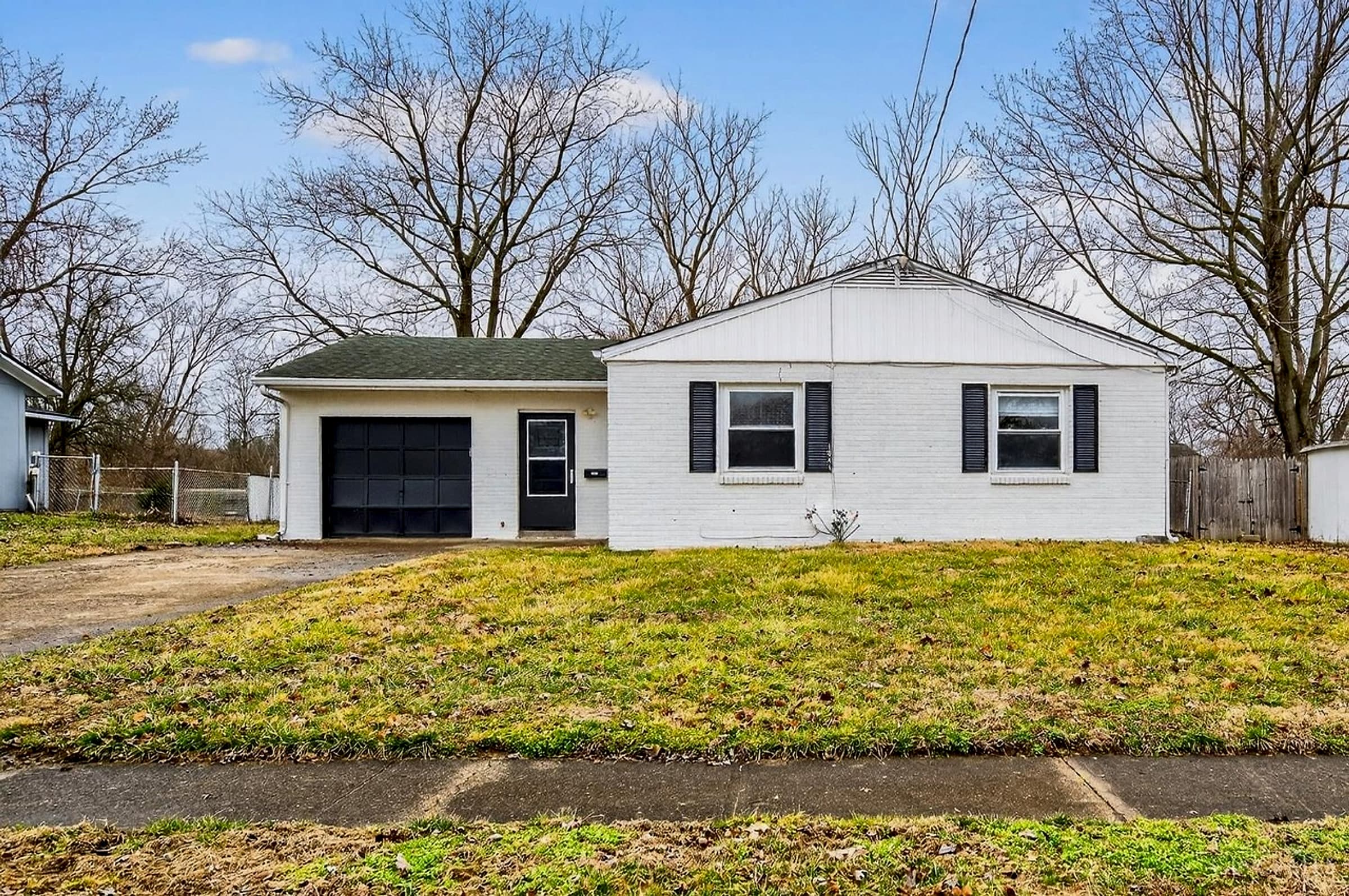 Front exterior of 1041 Sheffield Drive, a painted-brick residence in Mason, OH